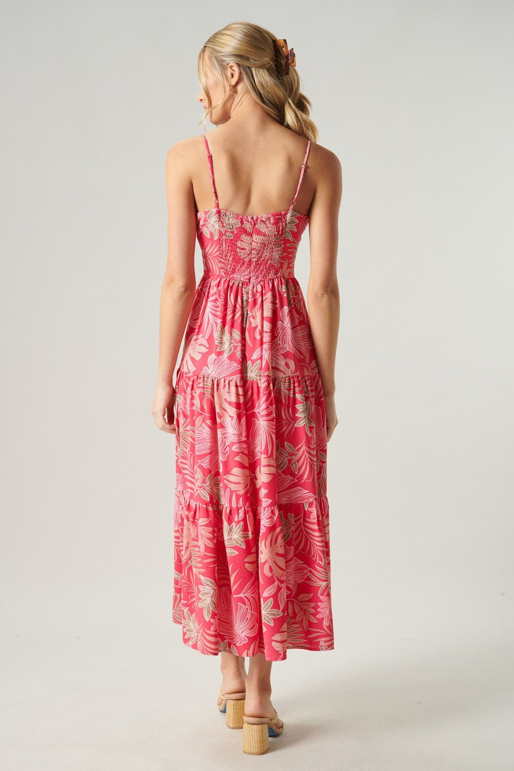 Back view of Island Happy Dress, a pink floral beach dress, ideal for tropical vacations or coastal boutique clothing.