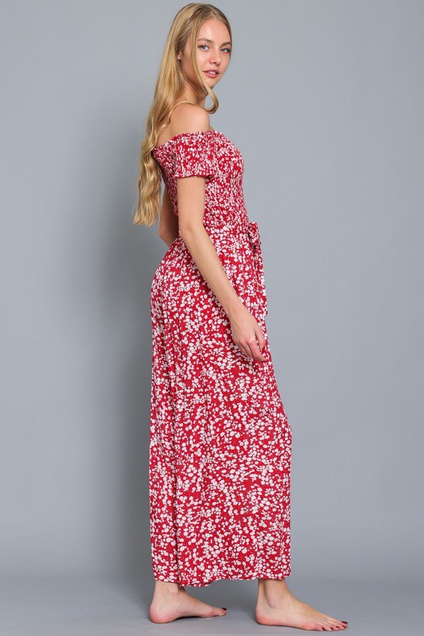 Women wearing a RED AND WHITE SMOCKED JUMPSUIT from Raggdoll Boutique for trendy coastal style.
