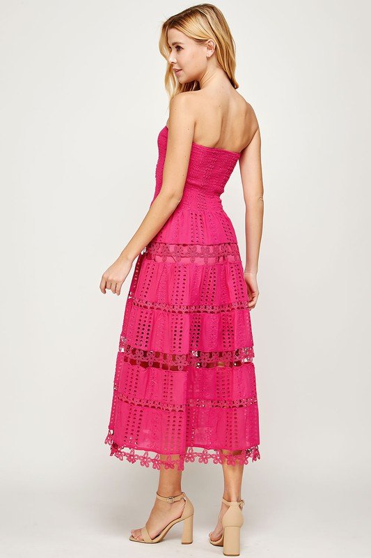 CAUGHT MY EYELET FUSHIA DRESS showcased from the back, featuring tiered lace and a smocked bodice perfect for summer outfits Texas.