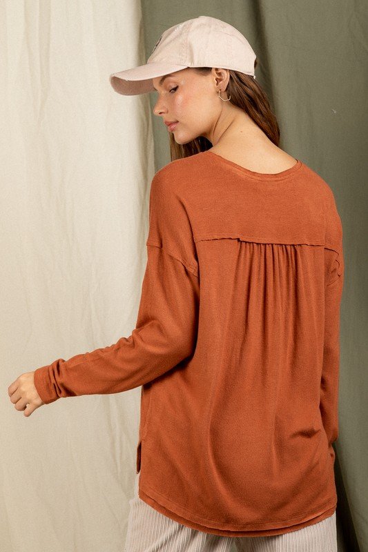 Back view of OH SO SOFT V-NECK TOP BRICK/MOCHA from Raggdoll Boutique in Port Aransas, featuring a trendy coastal style.