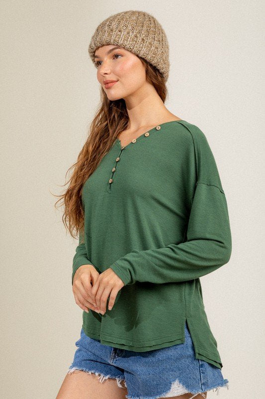 FOREST GREEN BUTTON DOWN HENLEY from Raggdoll Boutique, perfect for trendy coastal style and summer outfits in Texas.