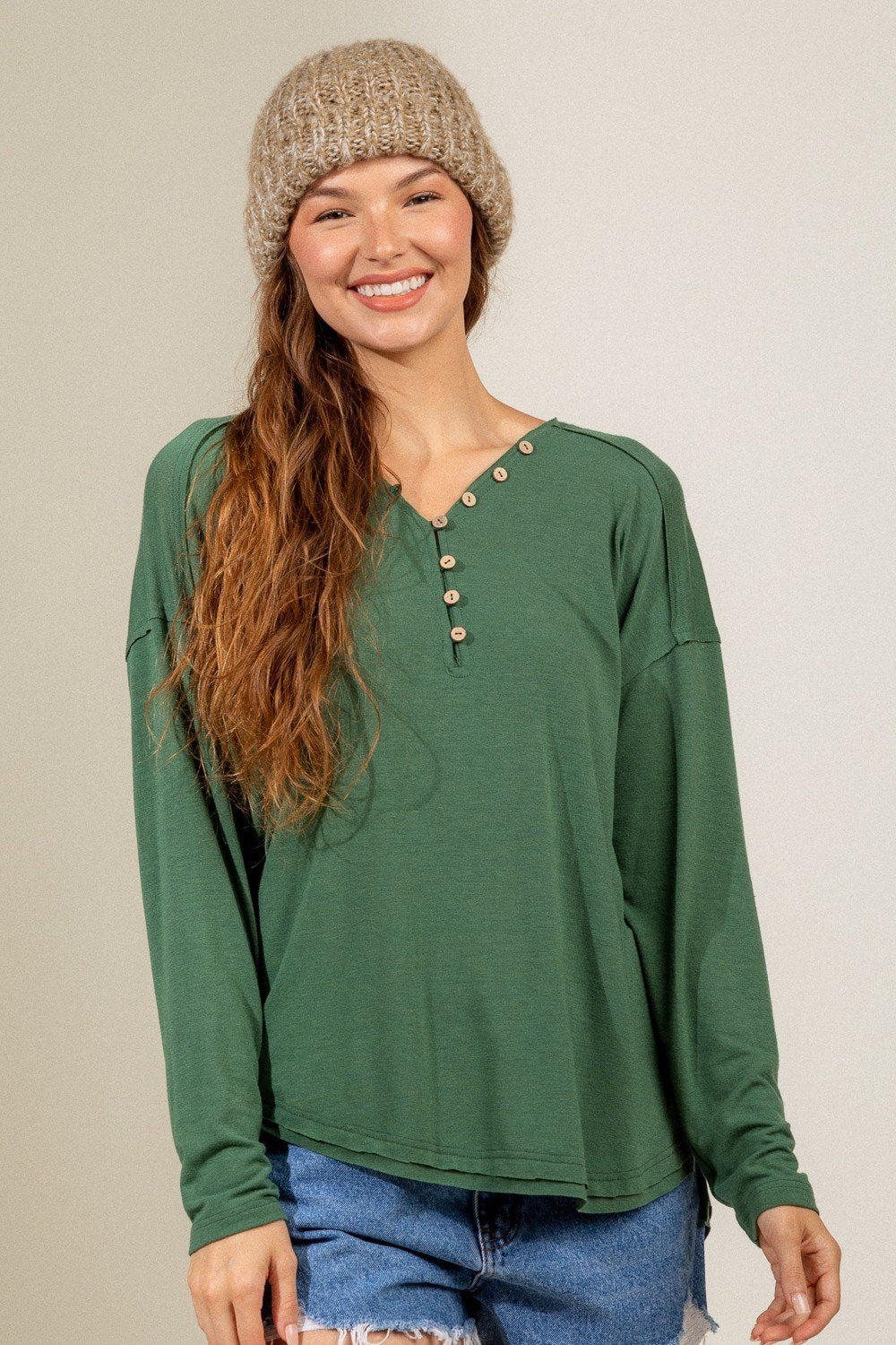 FOREST GREEN BUTTON DOWN HENLEY paired with a cozy beanie, stylish for summer outfits Texas at Raggdoll Boutique.