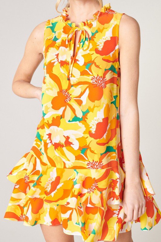 Women’s dress from Raggdoll Boutique, IN THE TROPICS, featuring vibrant floral patterns and trendy coastal style.