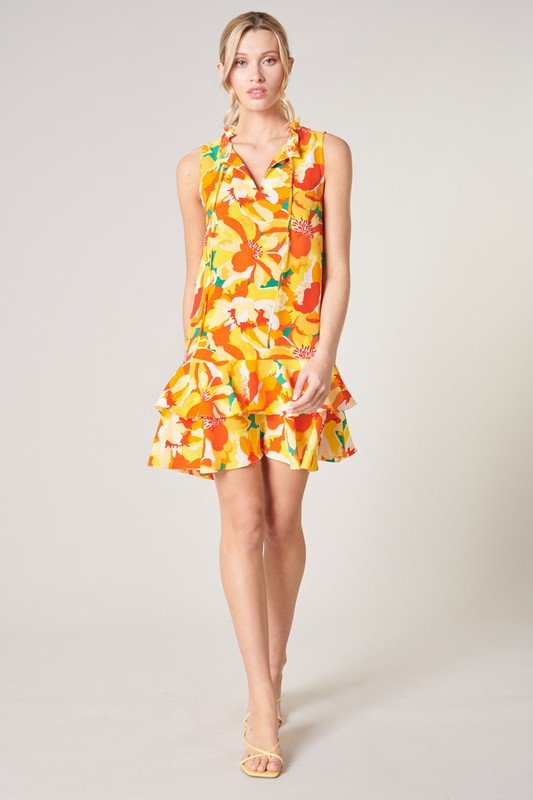 Model wearing a vibrant dress from Raggdoll Boutique, perfect for summer outfits Texas in the Tropics style.
