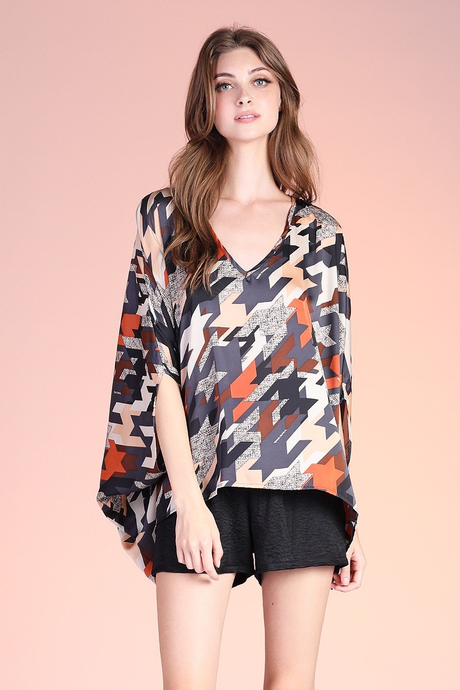 Navy graphic caftan top from Raggdoll Boutique showcasing trendy coastal style for summer outfits Texas.