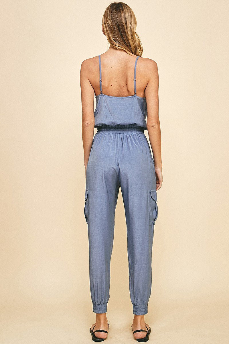 Back view of DUSTY BLUE JUMPSUIT showcasing trendy coastal style from Raggdoll Boutique.