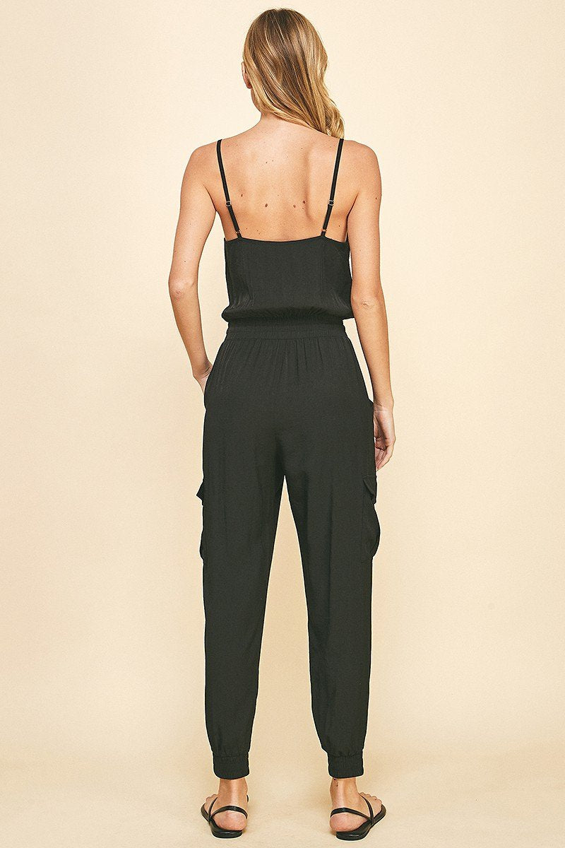 Back view of BLACK SATIN JUMPSUIT showcasing trendy coastal style from Raggdoll Boutique.