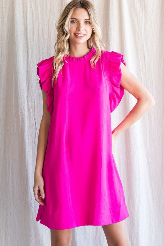 Bright pink Kat Dress with ruffled sleeves, perfect for beach outings and coastal boutique clothing. Curated women's fashion.