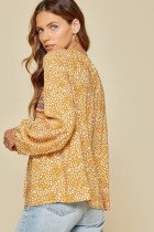 SAVANNA JANE MARIGOLD TOP featured in leopard print with banded sleeves for trendy coastal style.