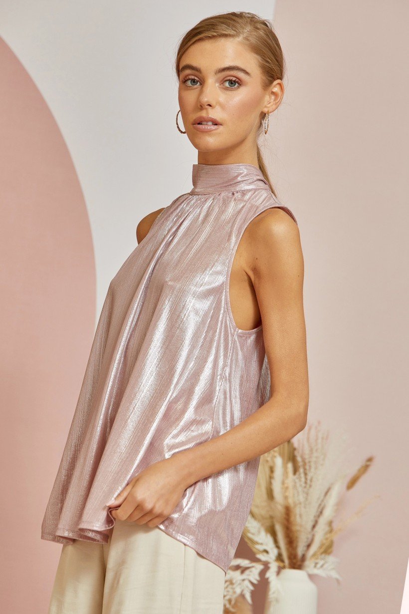 Model showcasing the BLUSH SHIMMER TOP from Raggdoll Boutique, perfect for trendy coastal style and summer outfits Texas.