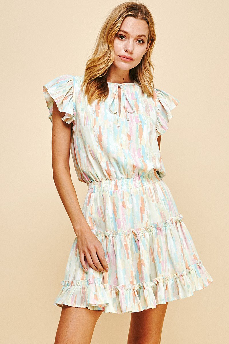 Watercolor dress featuring ruffled sleeves; perfect for coastal boutique clothing and tropical vacations from Port Aransas.
