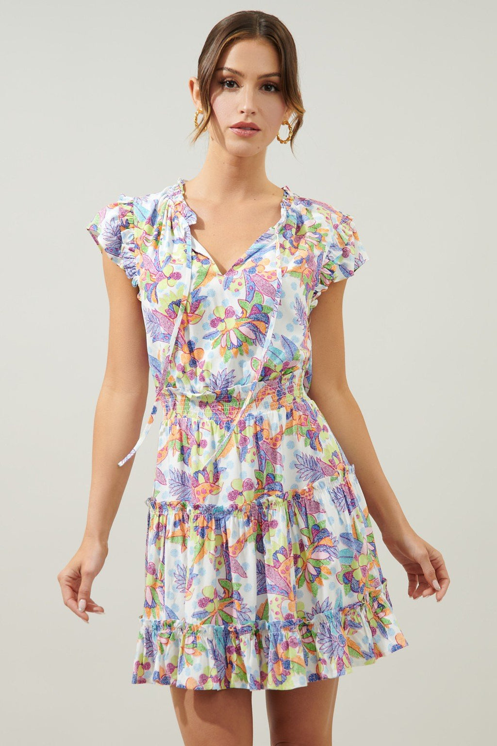 Sincere dress with vibrant floral print, perfect for tropical vacations. Available at coastal boutique clothing in Port Aransas.