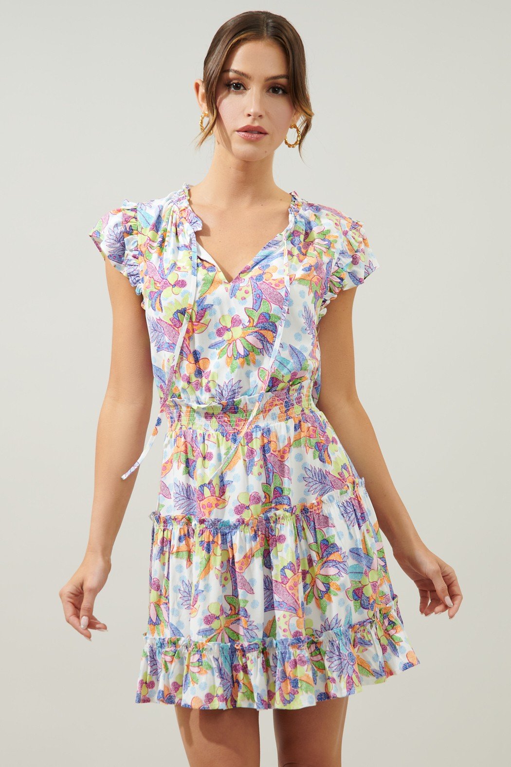 Sincere dress with vibrant floral print, perfect for tropical vacations. Available at coastal boutique clothing in Port Aransas.