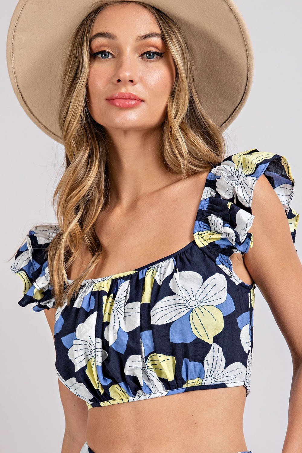FLIRTY IN FLORALS 2 PIECE TOP AND SKIRT featuring a stylish floral crop top.