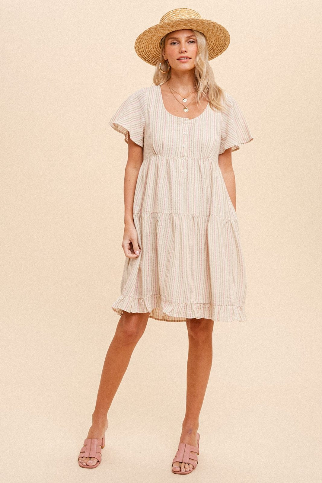 HEM & THREAD TIERED BABYDOLL MINI DRESS on model, showcasing trendy coastal style at Raggdoll Boutique.