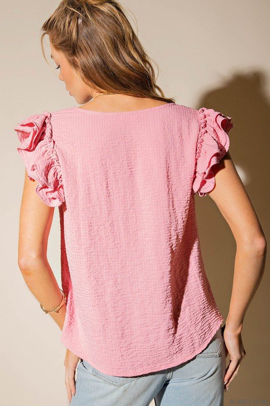 PINK BUBBLE GUM TOP featuring ruffle sleeves, perfect for trendy coastal style from Raggdoll Boutique.