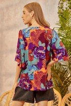 MAGENTA AND TURQUOISE PRINT TOP worn by model, showcasing trendy coastal style from Raggdoll Boutique.
