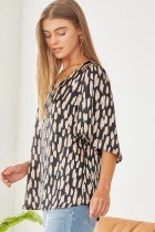 Pretty Black Mocha Blouse worn by model, showcasing trendy coastal style from Raggdoll Boutique.