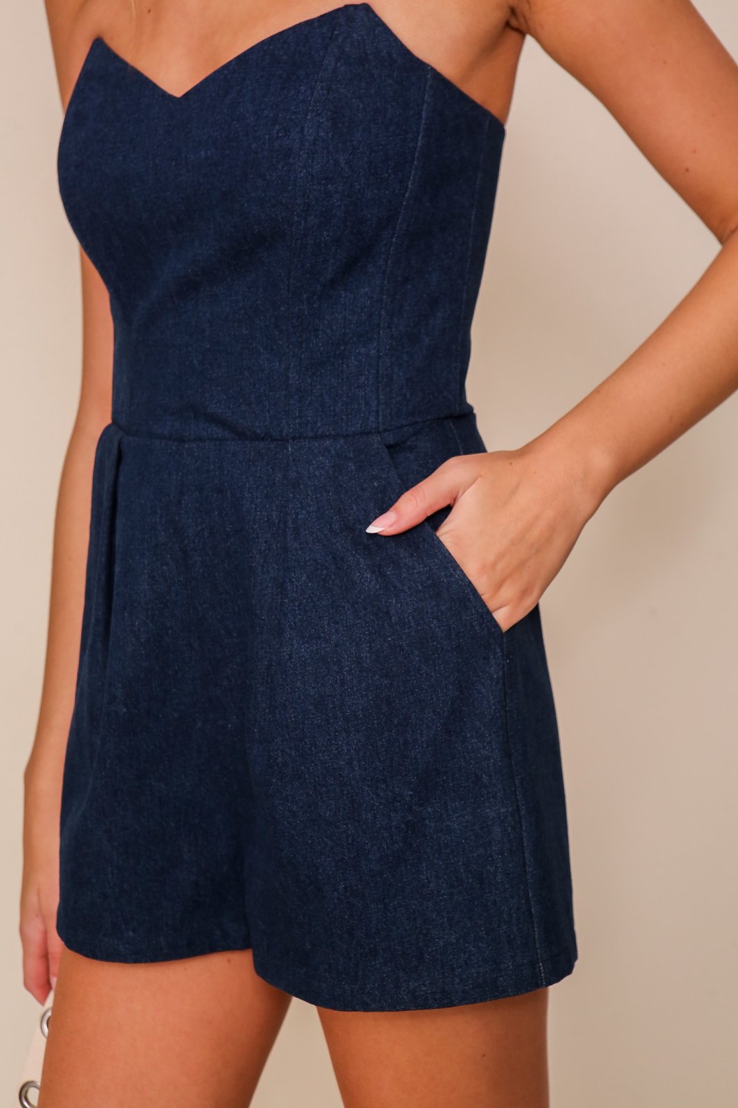 Ava Romper showcasing a sleeveless off shoulder denim design, perfect for trendy coastal style by Raggdoll Boutique.