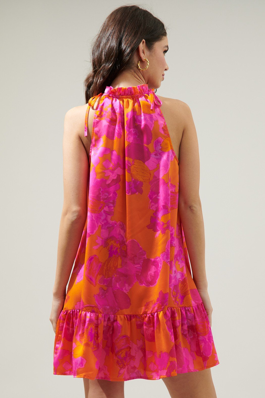 Back view of the MAI TAI FLORAL RUMBA HALTER DRESS in vibrant fuchsia and orange. Perfect for tropical vacation and coastal boutique clothing.