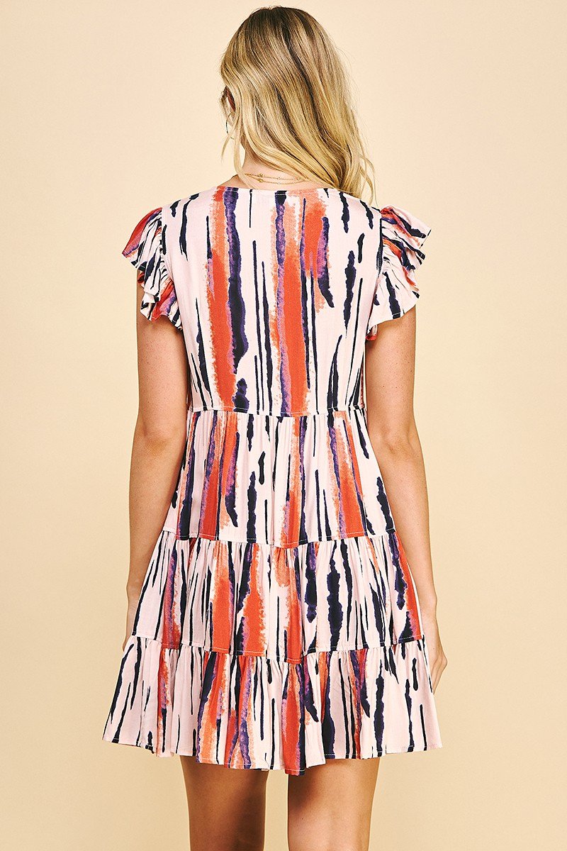 ABSTRACT THOUGHTS DRESS from Raggdoll Boutique featuring colorful ruffles, summer style for coastal fashion in Port Aransas.