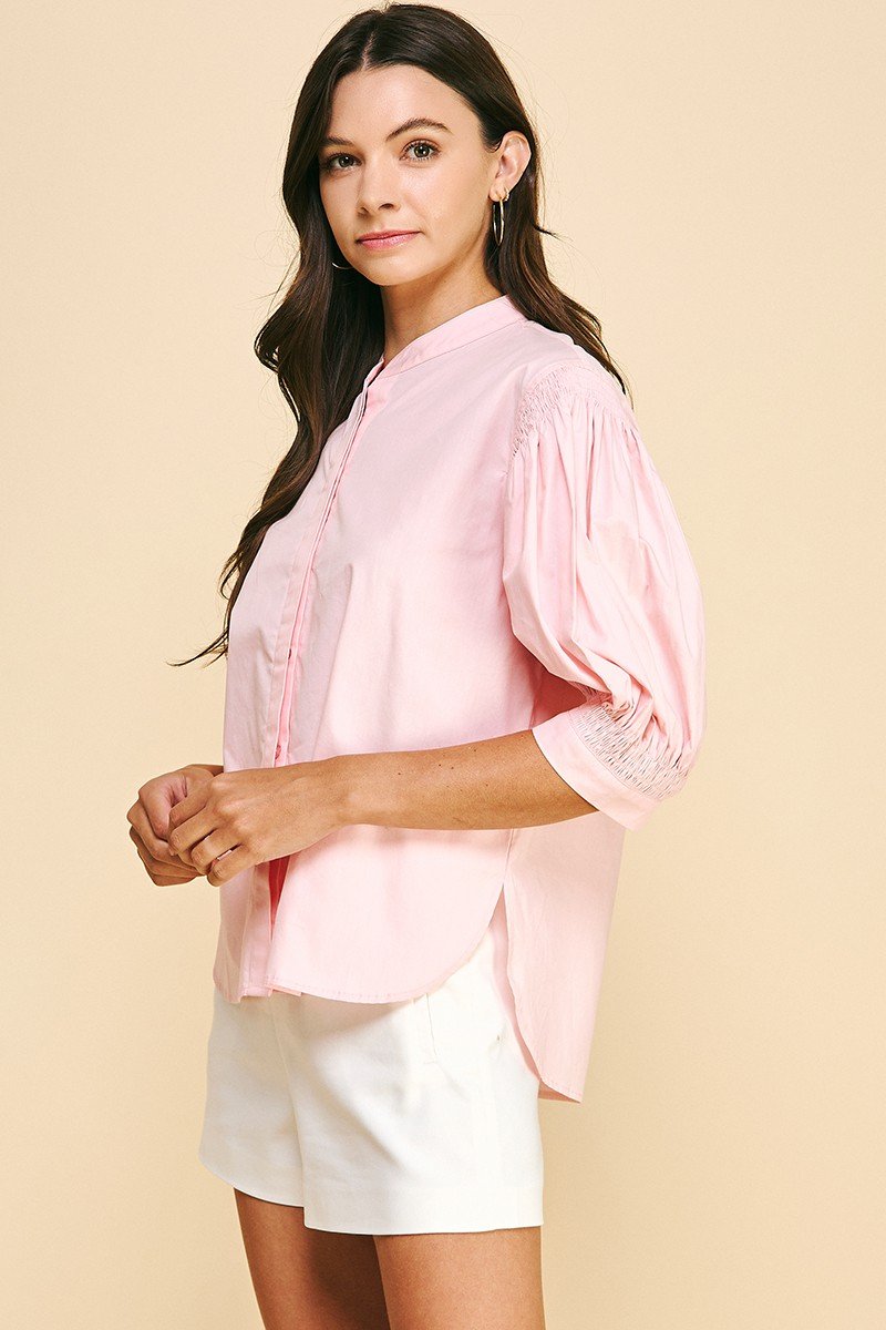 SWEET PINK SMOCKED SLEEVE TOP styled with shorts, perfect for trendy coastal style at Raggdoll Boutique.