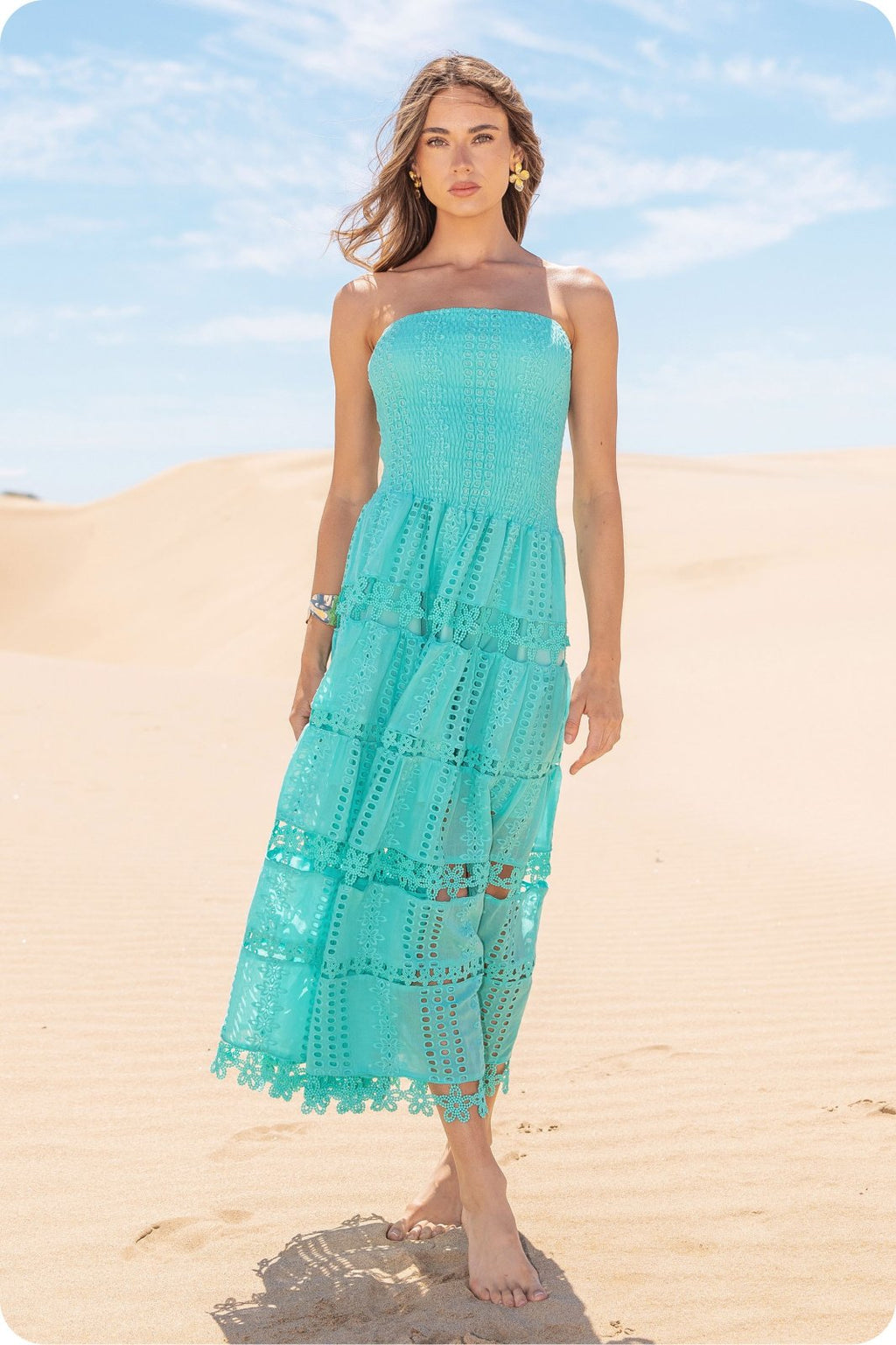 Model wearing the TIffany Dress in turquoise, a strapless midi dress perfect for summer outings, available at Raggdoll Boutique.