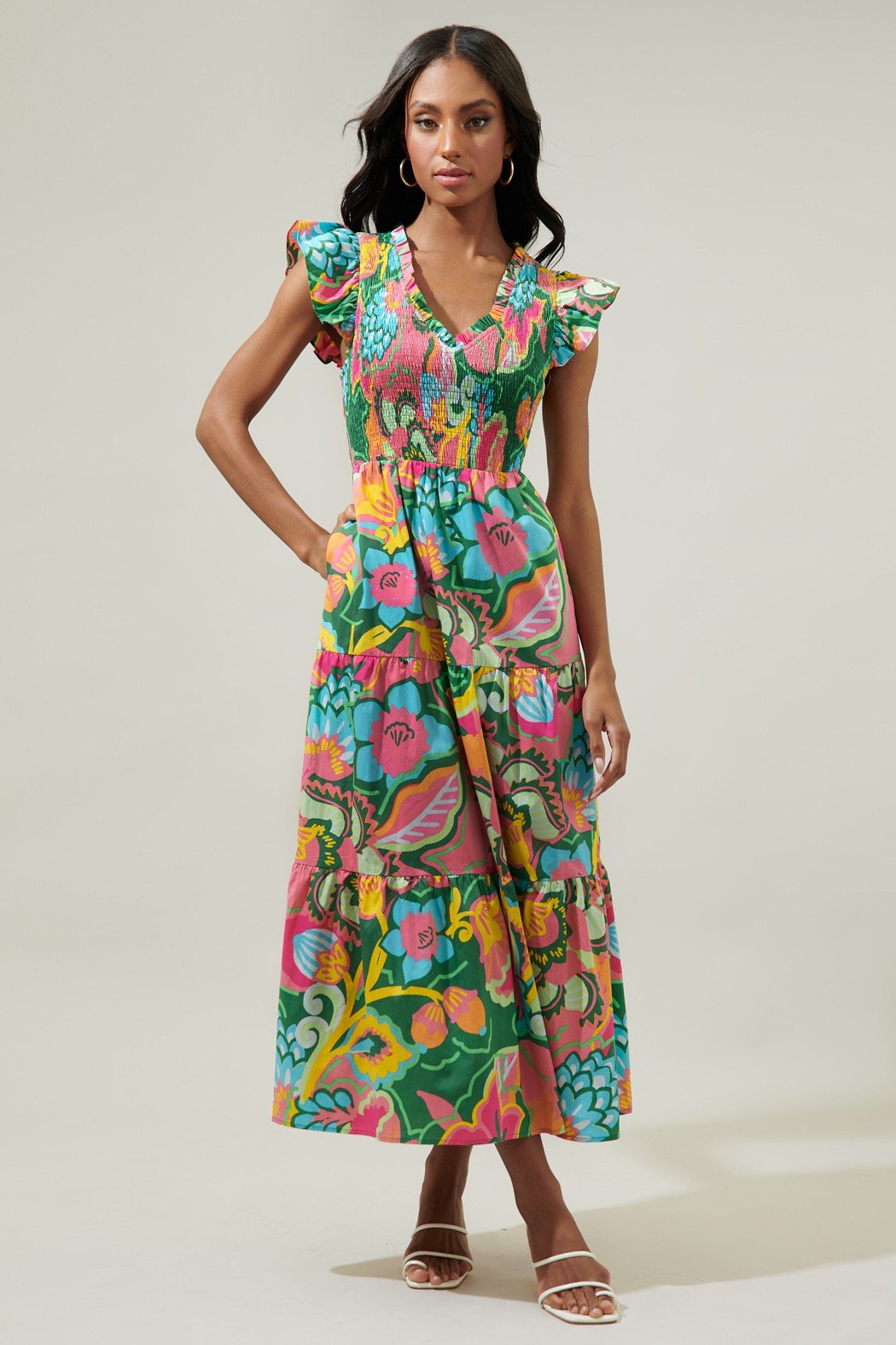 Model wearing the Lanai Dress, a vibrant floral boutique dress from Raggdoll Boutique, perfect for summer outfits Texas.