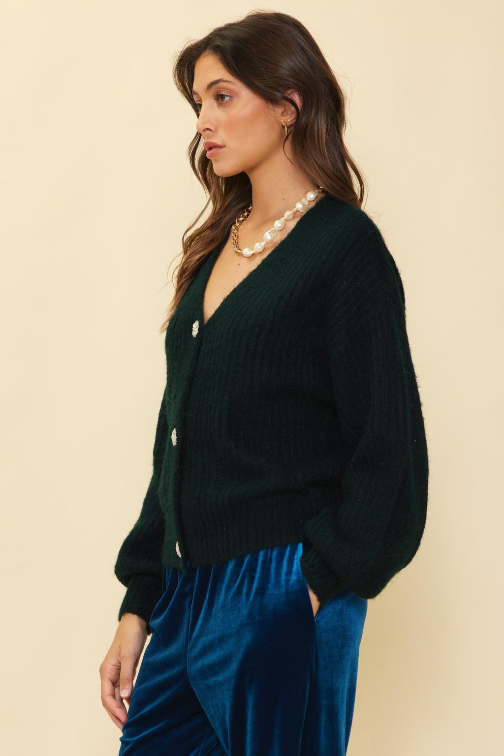 Very deep forest green cardigan with crystal buttons, perfect for coastal boutique clothing and curated women's fashion.