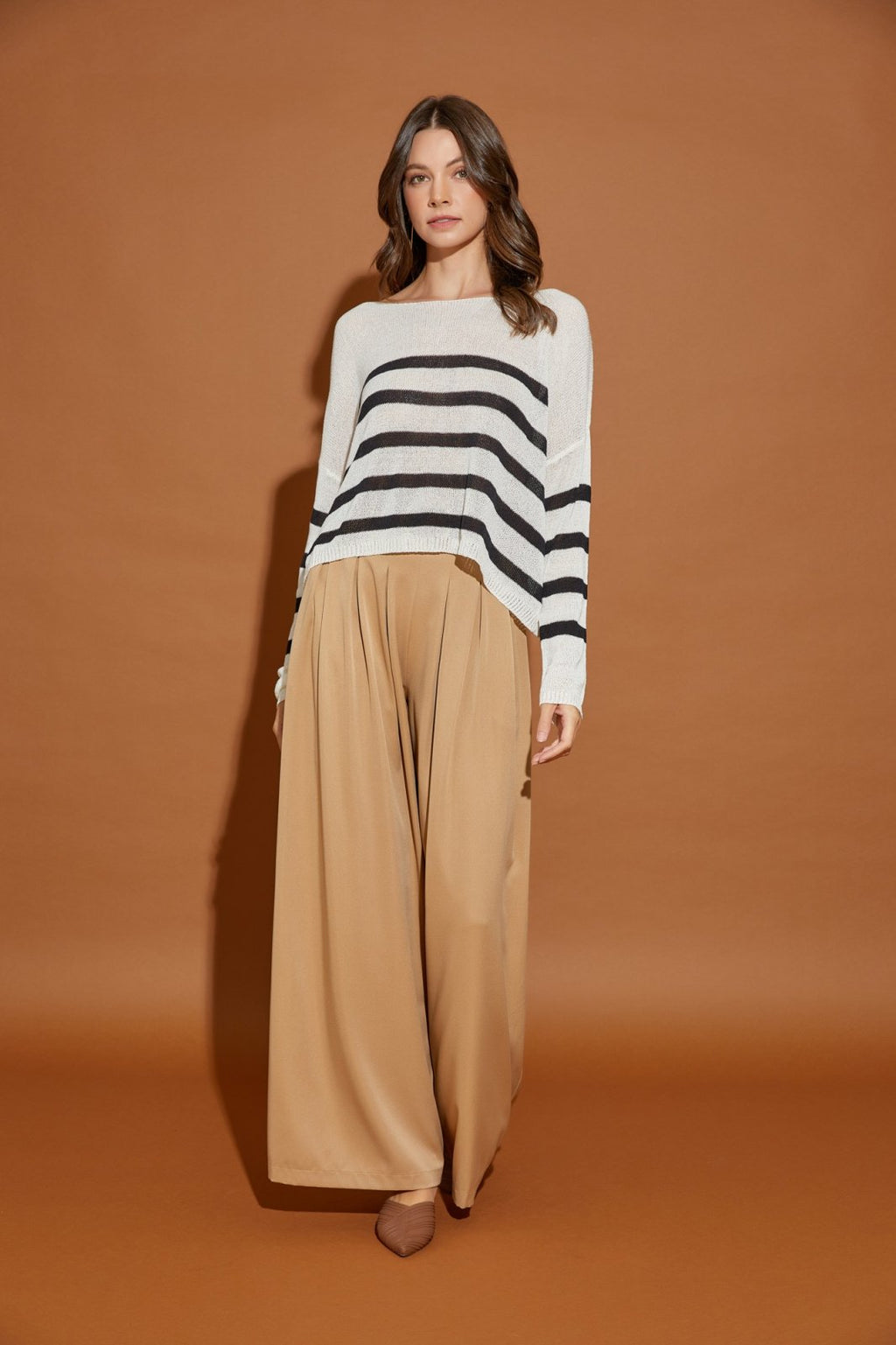 STRIPED KNITTED PULLOVER displayed with wide-legged pants, perfect for a trendy coastal style at Raggdoll Boutique.