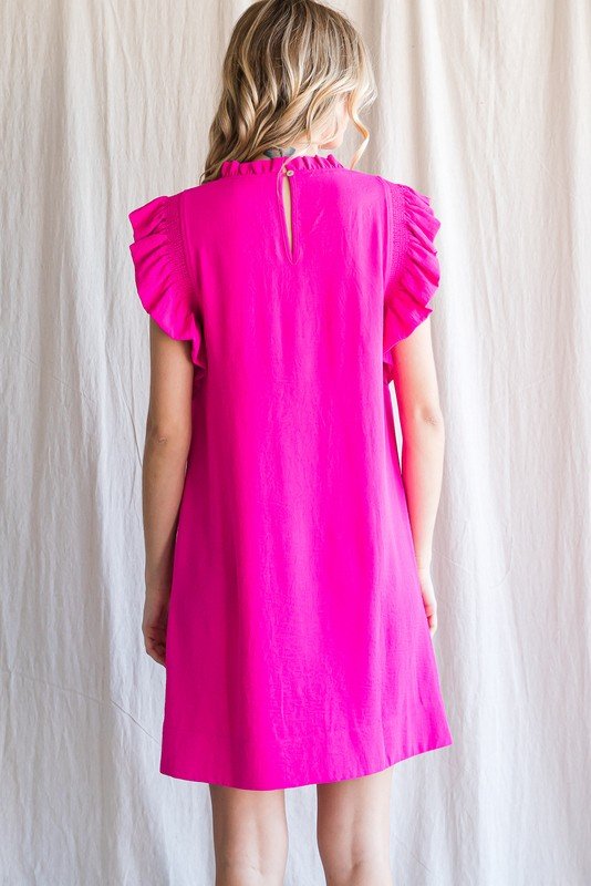 Back view of the vibrant pink Kat Dress, perfect for coastal boutique clothing and tropical vacation dresses.