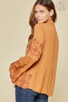 RUST EMBELLISHED BELL SLEEVE TOP showcasing elegant embroidery details, perfect for coastal fashion at Raggdoll Boutique.
