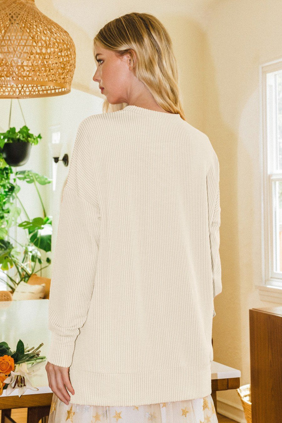 Model wearing (IVORY) TEXAS CREW PULLOVER from Raggdoll Boutique, showcasing trendy coastal style.