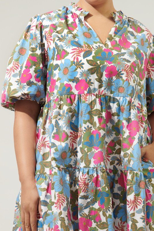 State of Grace Dress featuring a colorful floral print and ruffle neckline from Raggdoll Boutique.