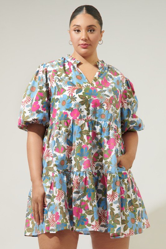 State of Grace Dress from Raggdoll Boutique features a floral print, ruffle split neckline, and bubble sleeves.