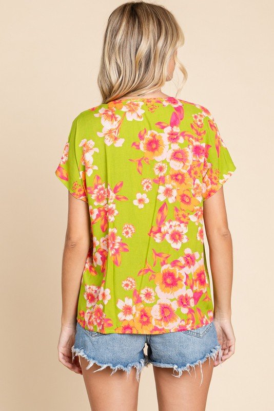 Allie Top from Raggdoll Boutique, featuring vibrant floral design and trendy coastal style.