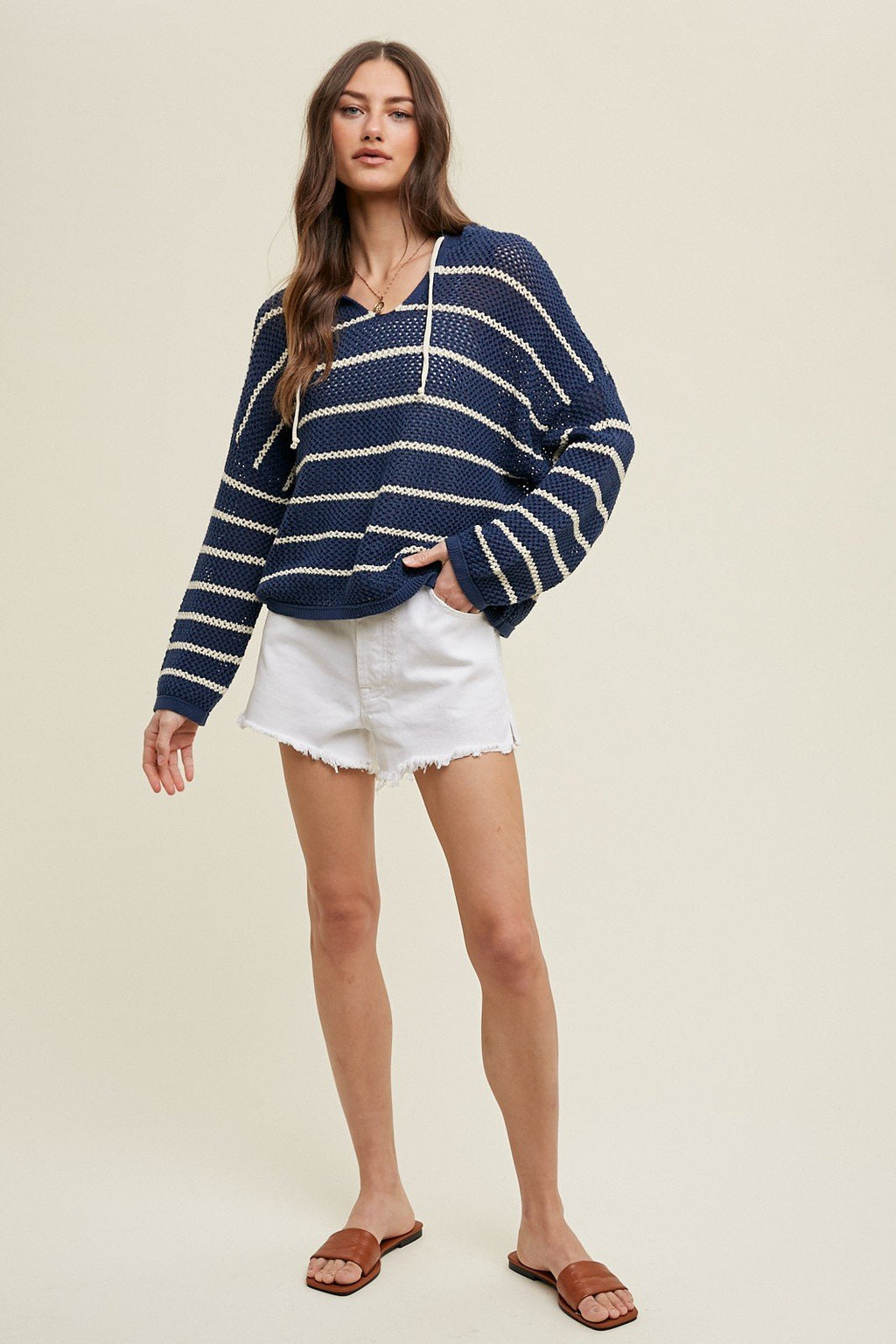 NAVY/ECRU STRIPED KNIT SWEATER styled with white shorts at Raggdoll Boutique in Port Aransas.