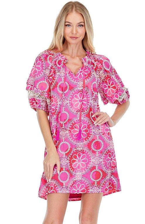 Vibrant pink Cosmos Dress from a Port Aransas boutique, perfect for tropical vacations and stylish women's fashion.