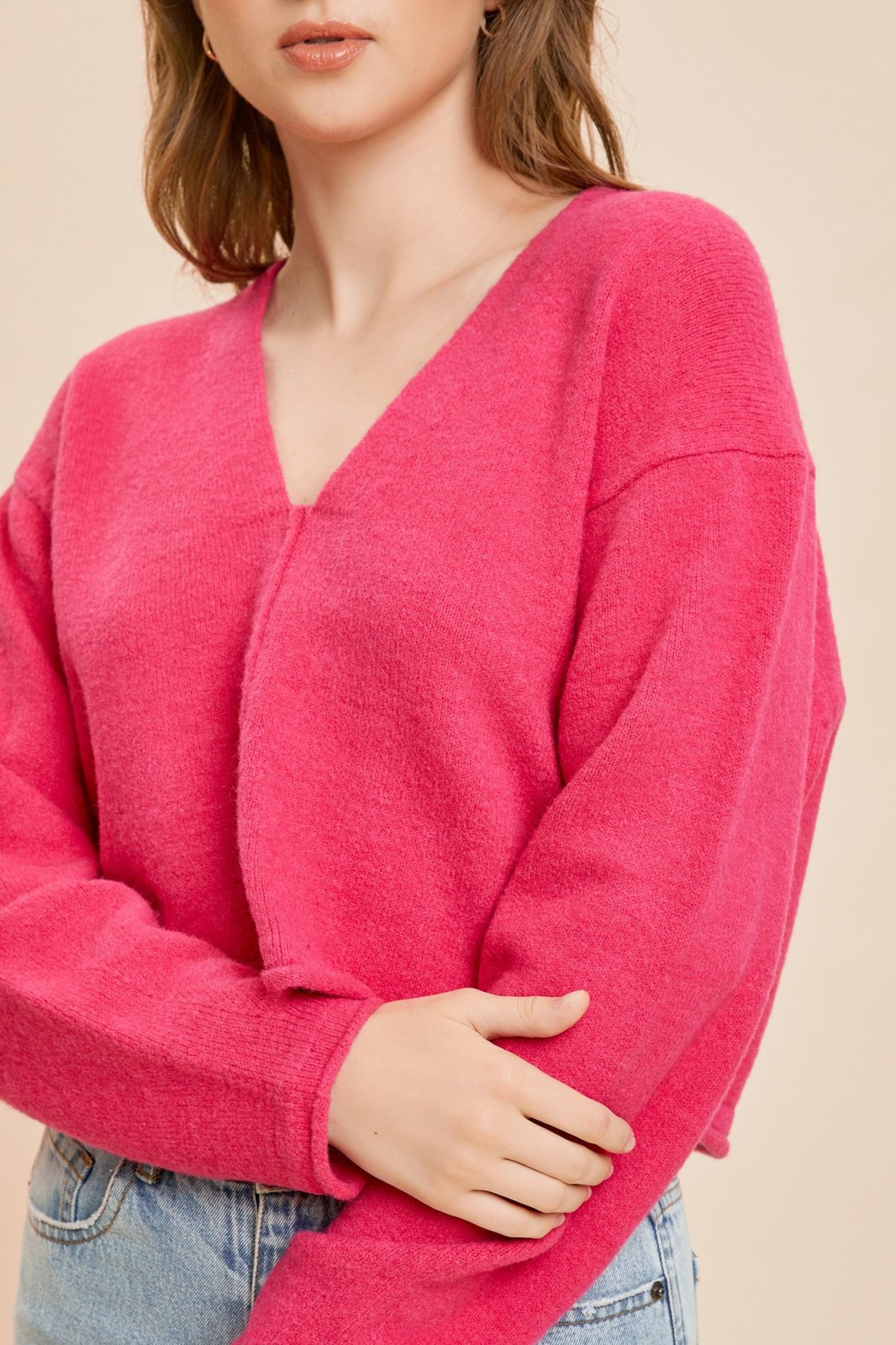 Popp'in Pink Pullover displayed on model, perfect for trendy coastal style at Raggdoll Boutique, Port Aransas boutique.