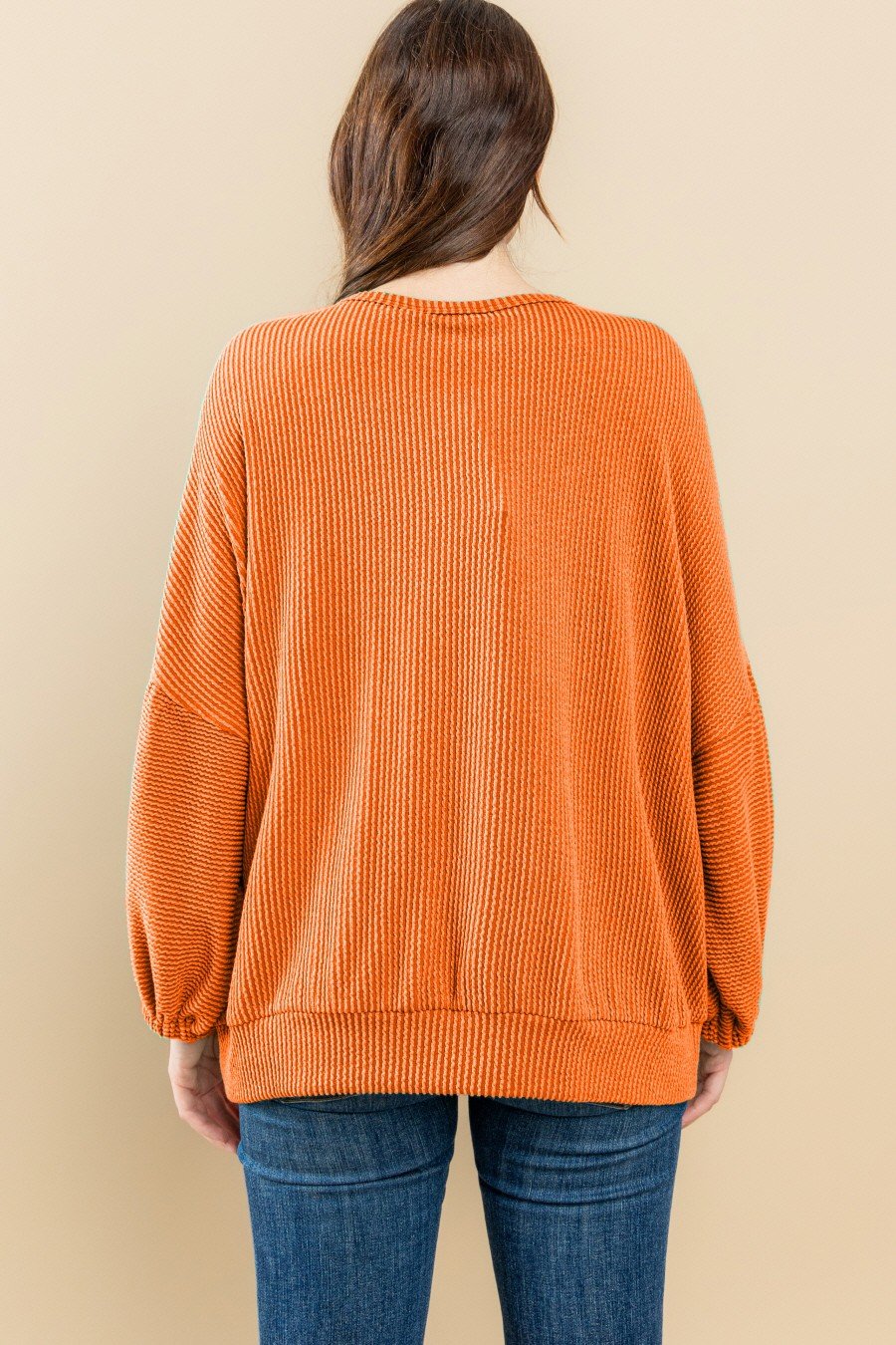 Back view of BURNT ORANGE TEXAS ROUND NECK PUFF SLEEVE sweatshirt from Raggdoll Boutique, ideal for trendy coastal style.