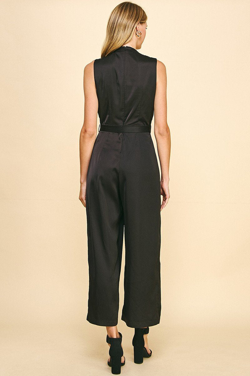 Back view of the Black Satin Sleeveless Belted Jumpsuit, perfect for trendy coastal style from Raggdoll Boutique.