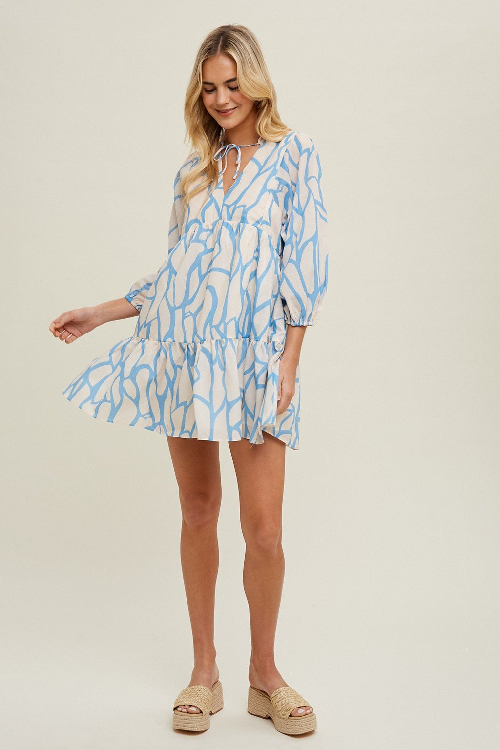 SKY BLUE ABSTRACT MINI DRESS from Raggdoll Boutique, perfect for trendy coastal style and summer outfits in Port Aransas.