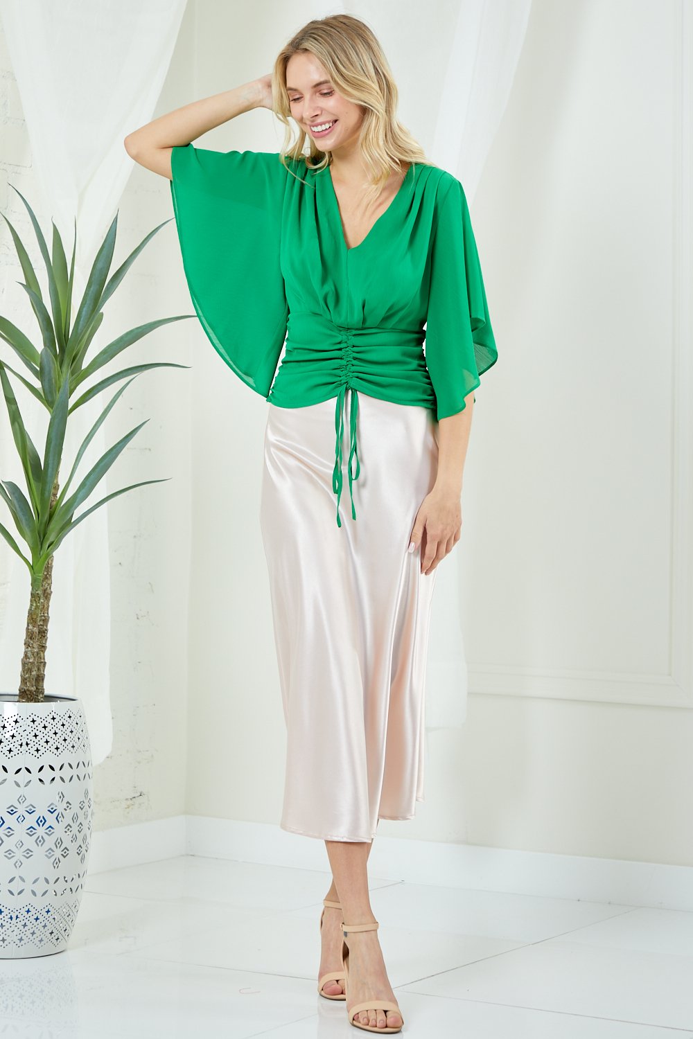 KELLY GREEN TOP with ruched detail and flair sleeves, perfect for trendy coastal style at Raggdoll Boutique.