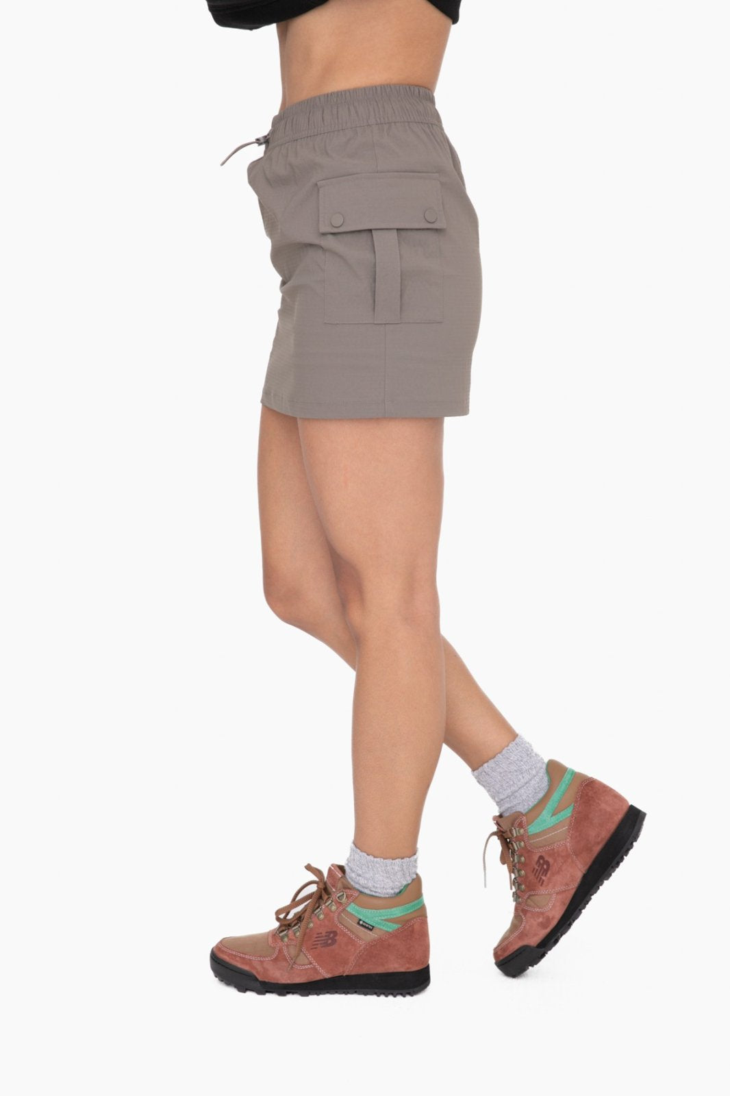 Stylish MONO B olive cargo skort for women, perfect for coastal boutique clothing and tropical vacations.