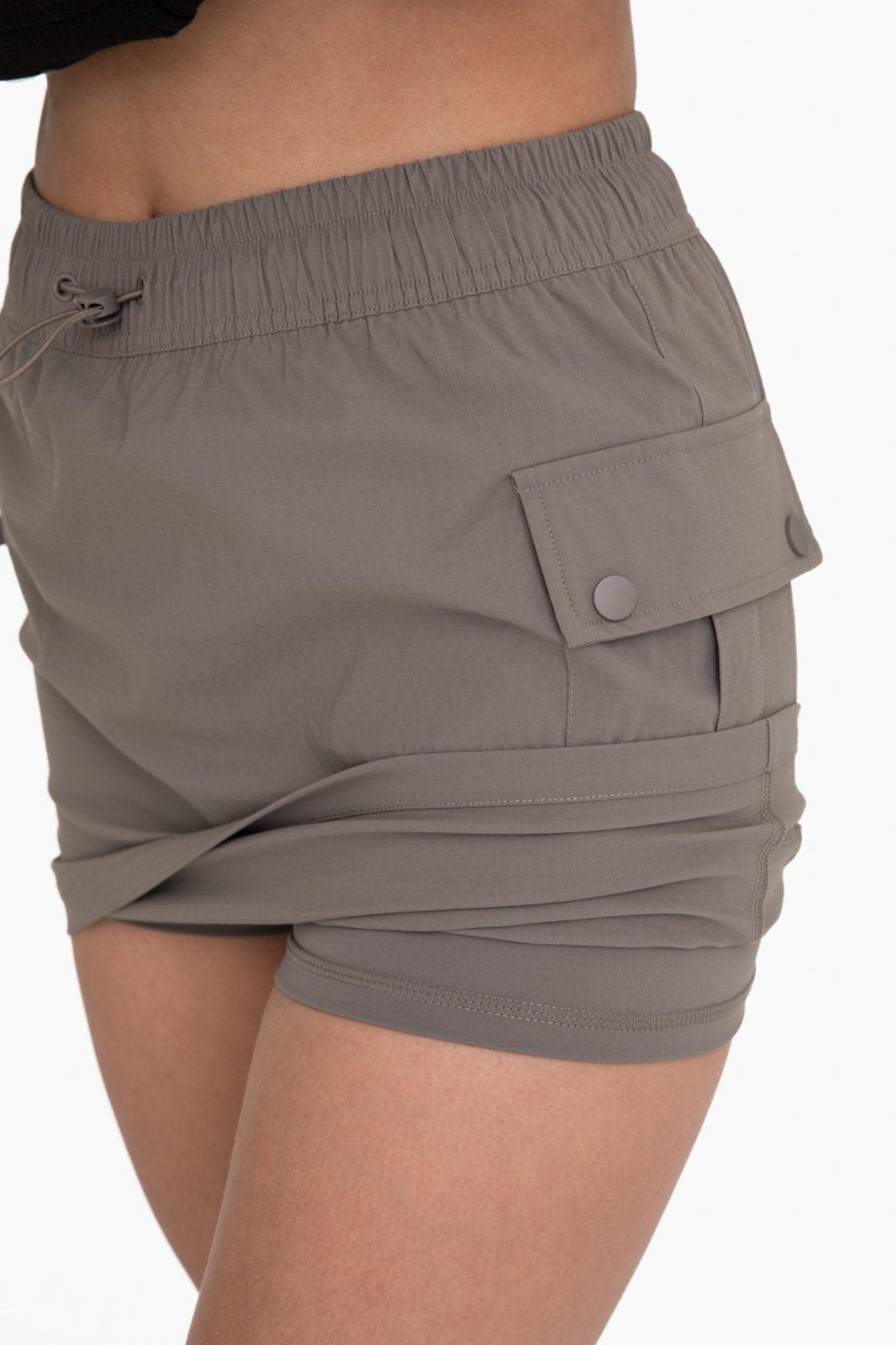 MONO B olive cargo skort showcasing stylish women's bottoms, perfect for coastal boutique clothing and tropical vacations.