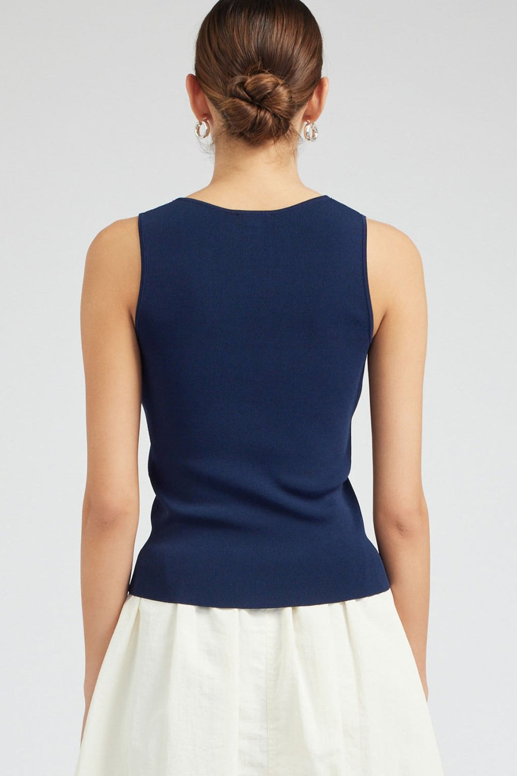 Navy V-Neck sleeveless sweater, a staple for curated women's fashion, perfect for beach dresses at our Port Aransas boutique.
