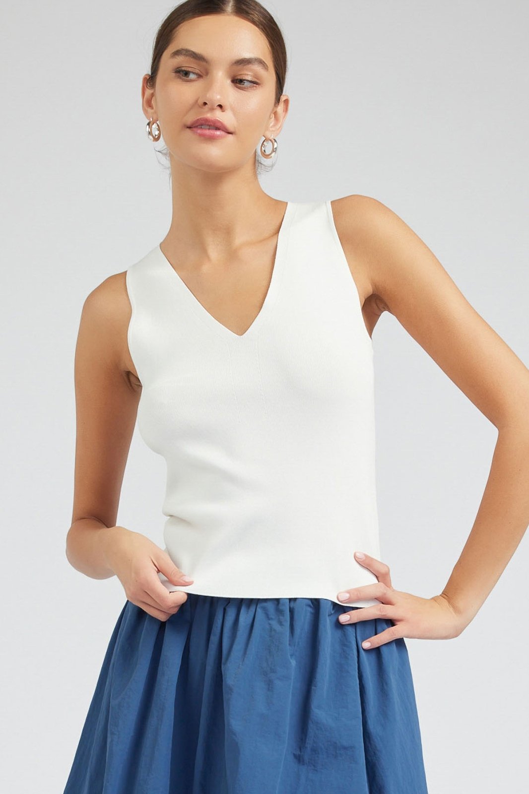 White V-Neck Sleeveless Sweater top, perfect for beach dresses and stylish tops for women at our Port Aransas boutique.
