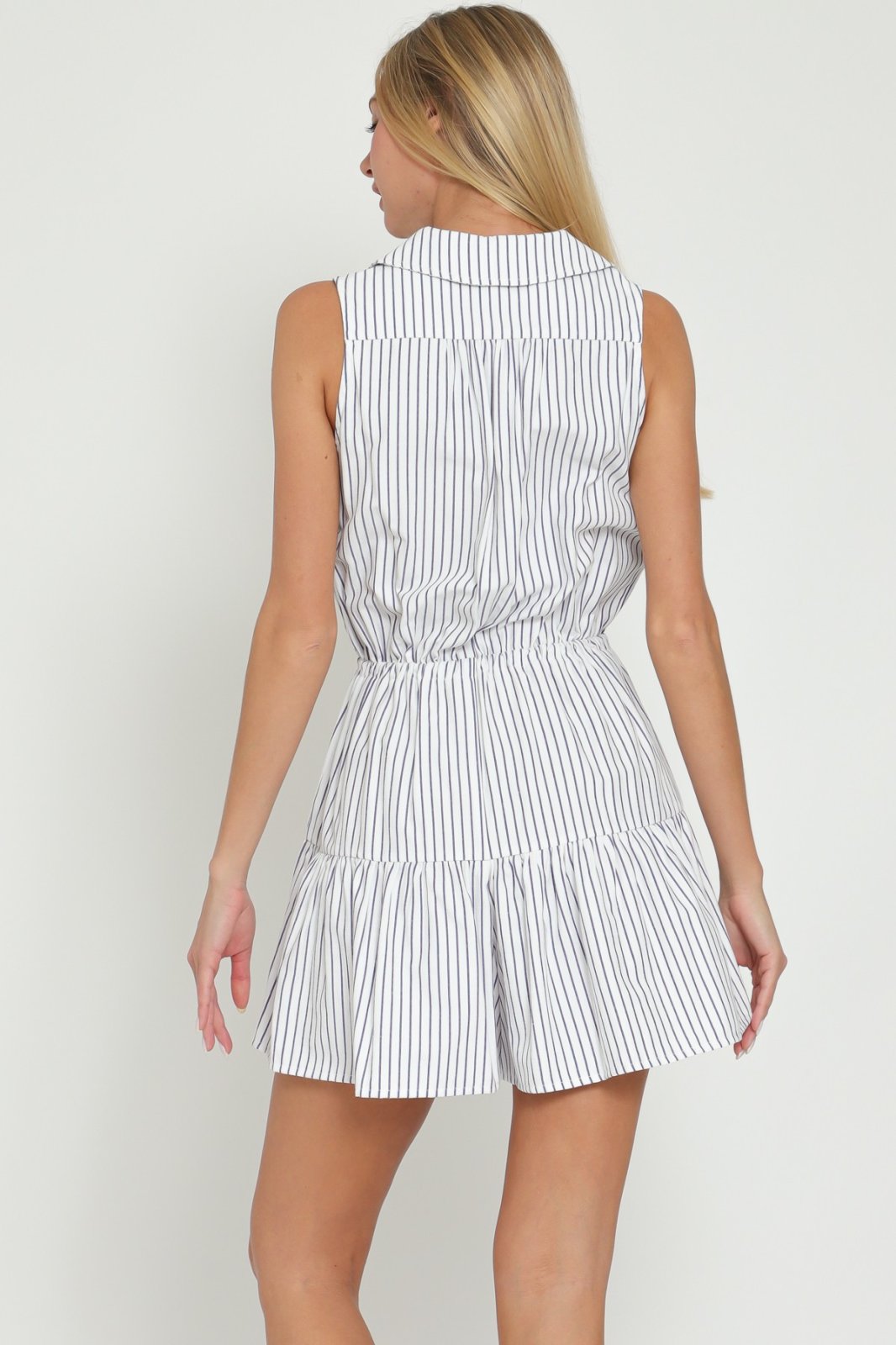 Back view of the White and Navy Striped Romper showcasing trendy coastal style from Raggdoll Boutique.