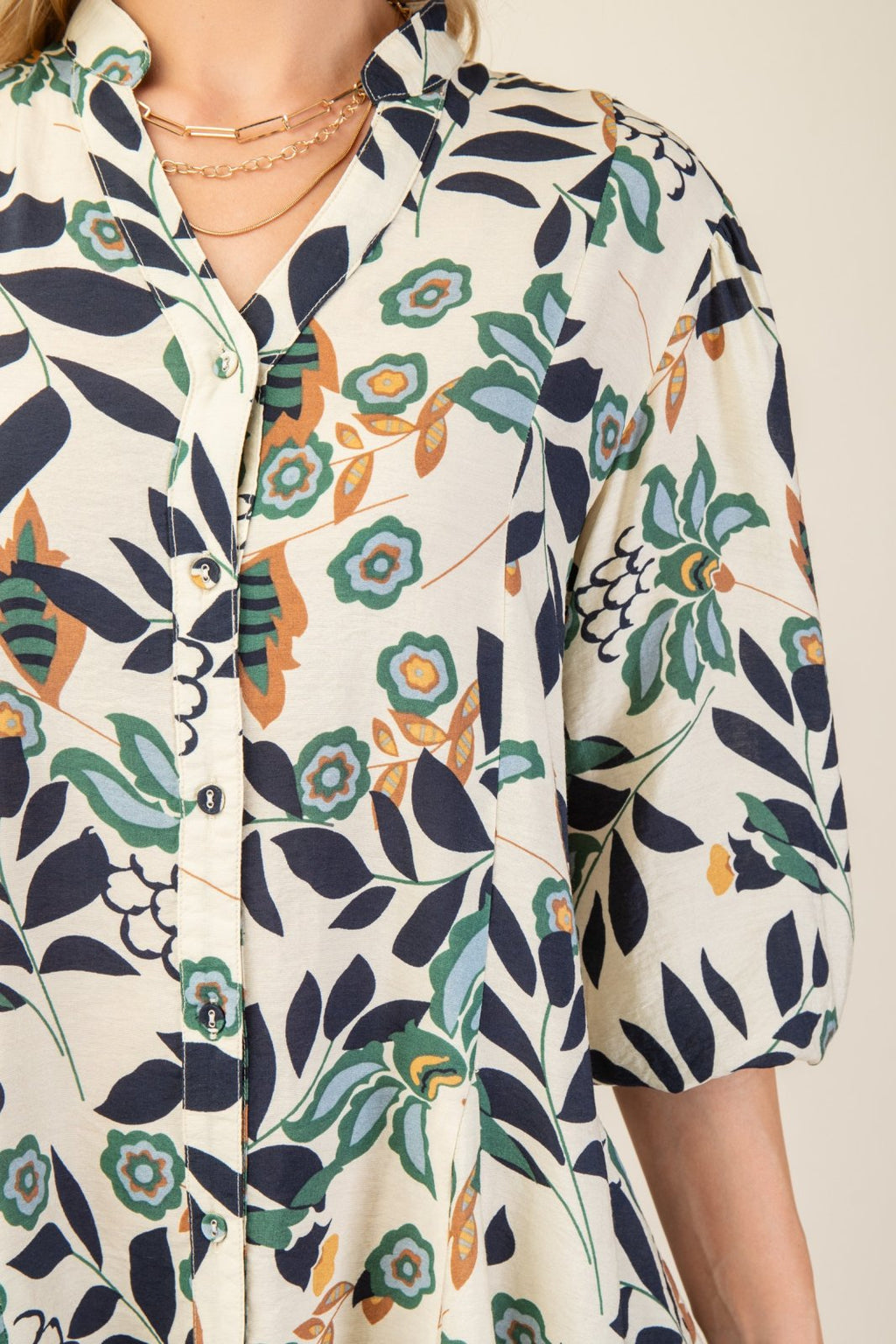 Stylish floral shirt from coastal boutique clothing, perfect for beach outings and curated women's fashion in Port Aransas.