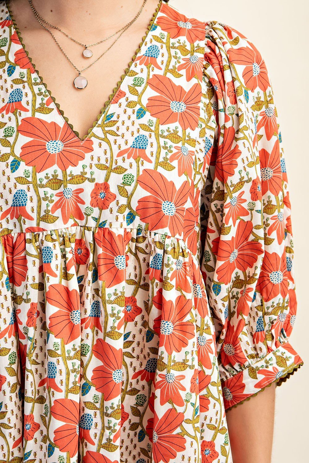 Paige Dress featuring vibrant floral patterns, perfect for beach outings and coastal boutique clothing collections.